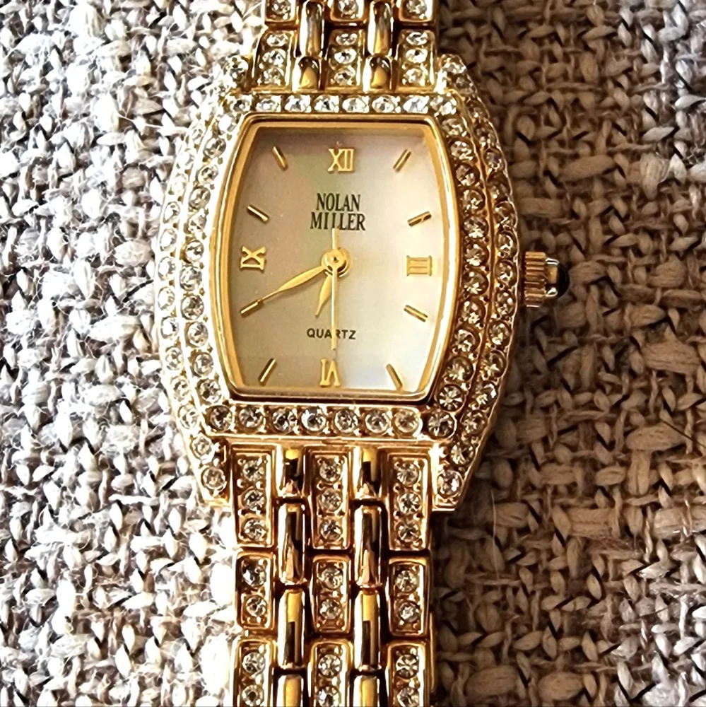 Vintage Nolan Miller crystal gold-tone watch.